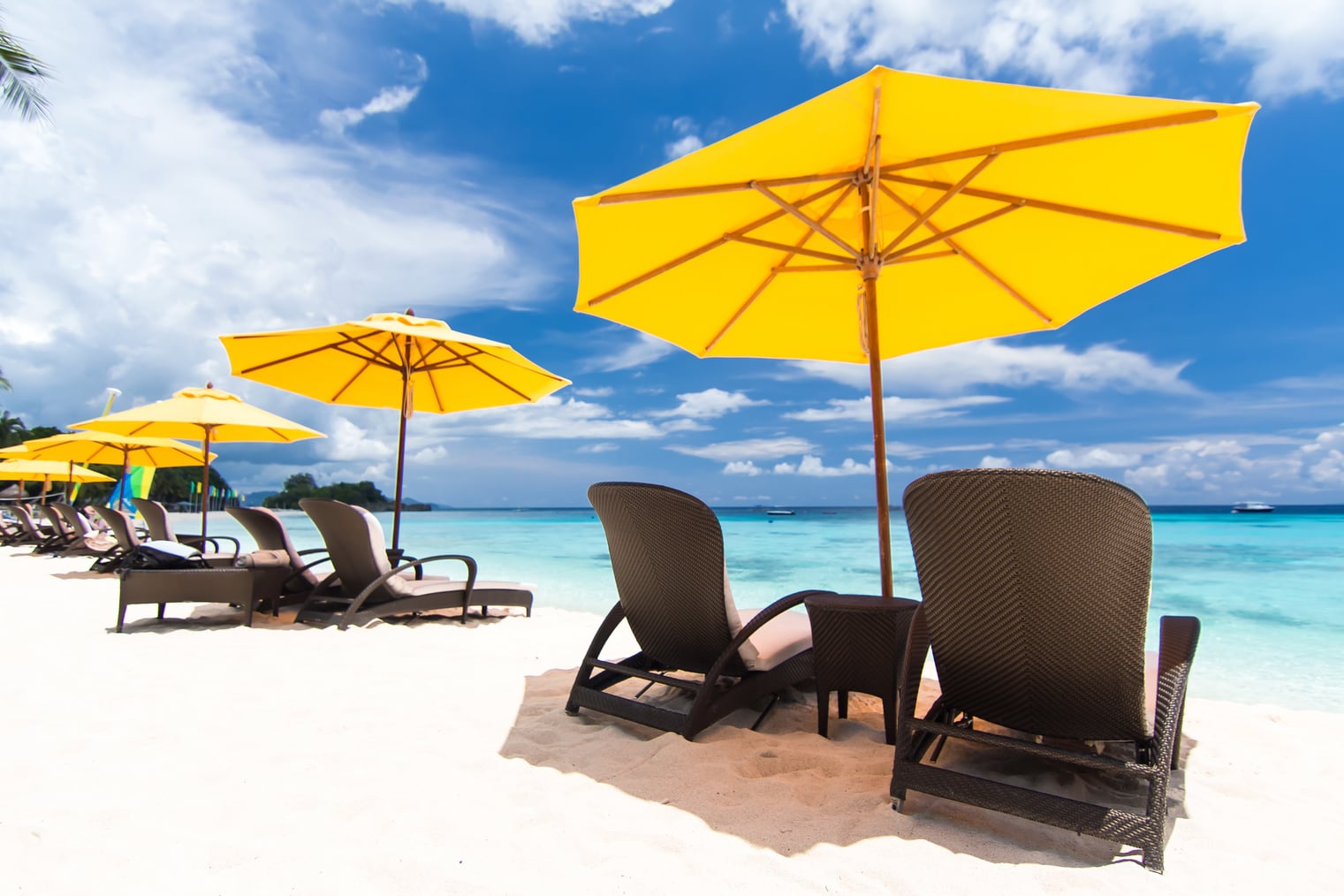 Sun umbrella and beach beds on beach